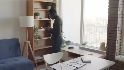 Man Using Tablet in Modern Home Office