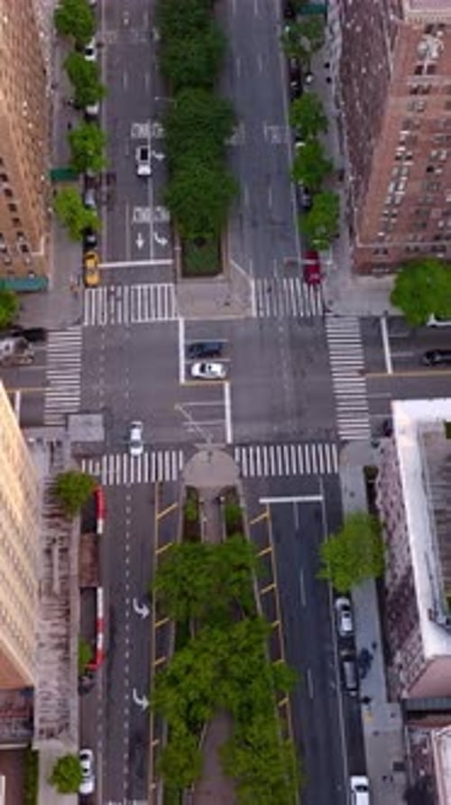 Aerial View of Urban Intersection with Cars