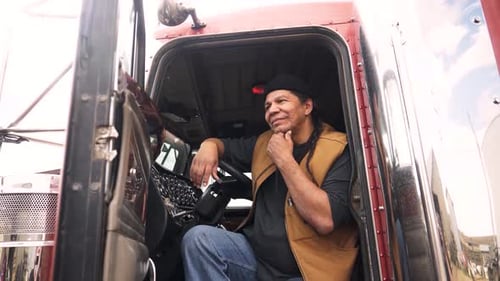 Thoughtful Male Farmer in Cabin of Semi Truck Adult