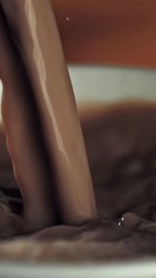 Hot Chocolate is Poured Into a Mug Filmed on a Highspeed Camera at 1000 Fps
