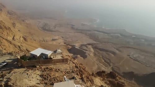 Aerial View of Desert Meeting a Body of Water