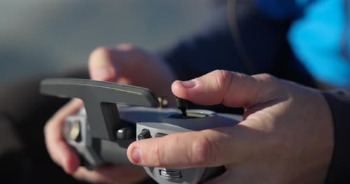 Hands Holding Drone Controller Unit. Close Up Shot