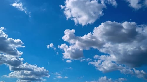 Clouds Slowly Drifting Across a Brilliant Blue Sky