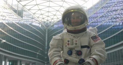Portrait of an astronaut just landed and walking for the first time in town and looks around in bo