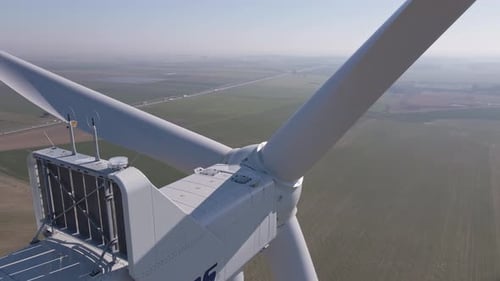Aerial View of Wind Turbine in Countryside Area Renewable Energy Concept