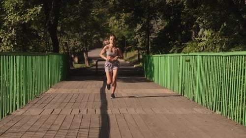 Fitness Woman Running In Park