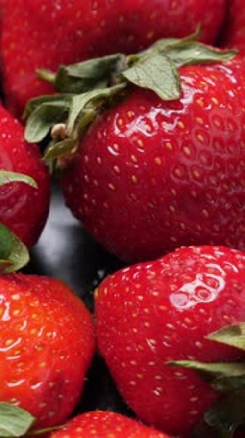 Strawberries Rotating Closeup Vertical