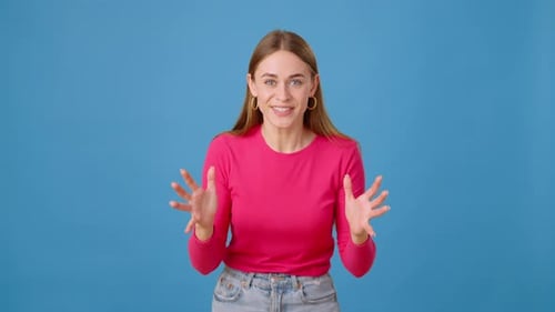 Focused Woman Cheering and Celebrating Victory in Studio
