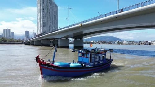 Fishermen Come Out of the Boat Bay Under the City Bridge