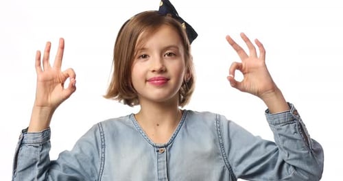 Smiling Girl Makes Okay Gesture