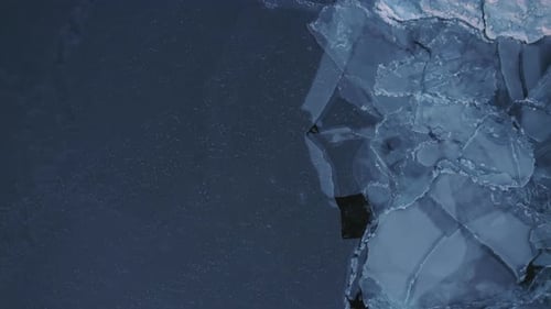 Top-Down Perspective Of Sheets Of Ice Covering The Arctic Sea