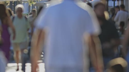 Blurry Silhouettes of People Walking on the Street