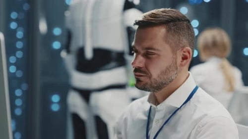 Professional Caucasian IT Engineer Young Technologist Programming Software Server Data Monitoring at