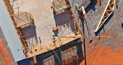 Installation of Wooden Roofing Trusses at New Residential Building Using a Crane