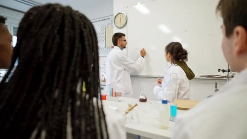 Science Teacher Explains Chemistry Formulas to Students