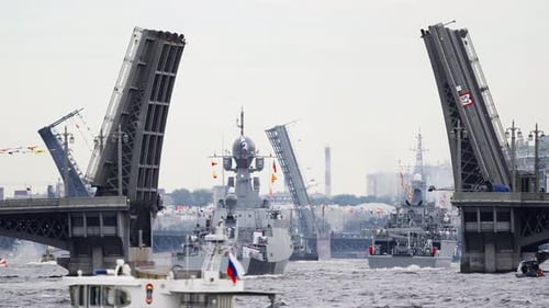 A Lot of Warships Goes Along the Neva River Under Open Bridges at the Time of the Celebration of the