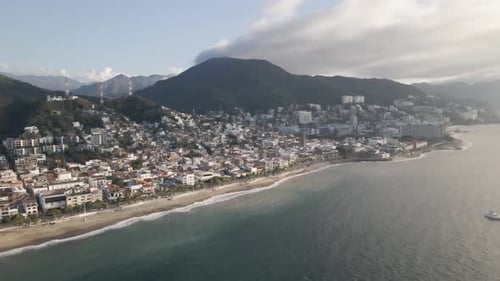 Drone Pushing into town looking over the Malecon Boardwalk Vallarta in Puerto Vallarta, Jalisco, Mex