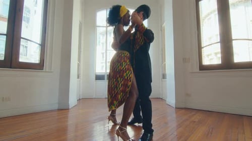 Couple of Performers Dancing Slow Tango in Studio