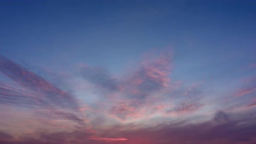 Pink Clouds Flowing in the Evening Sky