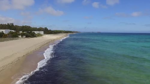 Drone flight over a white sandy beach on the Sardinian coast