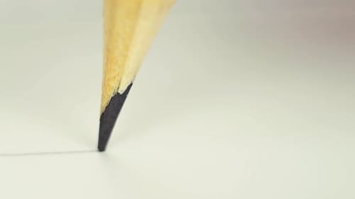 Close-up of Pencil Drawing a Straight Line