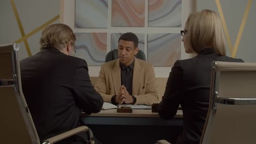 Team Discussing Business in a Modern Office