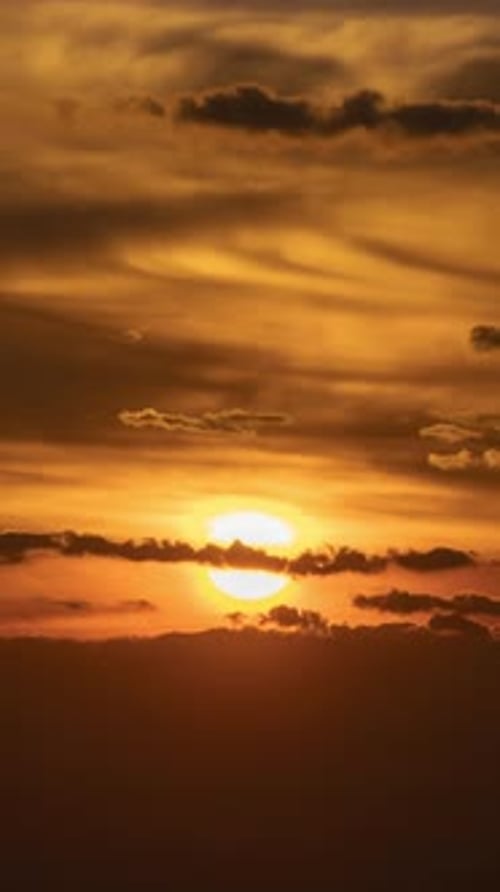 Golden Sunrise Time-Lapse Over Dark Clouds