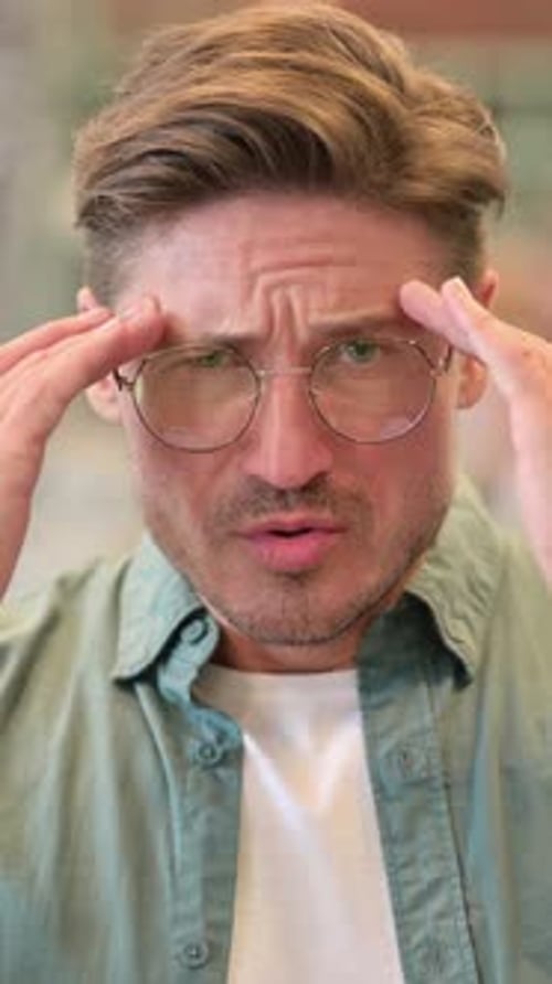Portrait of Exhausted Middle Aged Man having Headache, vertical video