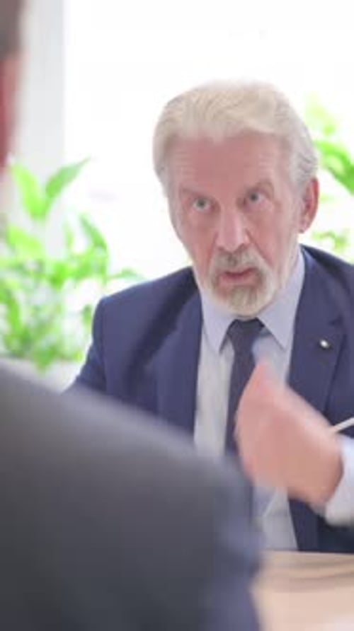 Senior Old Businessman Talking with Businessman in Office, vertical video