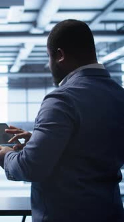 Vertical Video System Administrator in Server Room Installing Newly Ordered Storage Unit