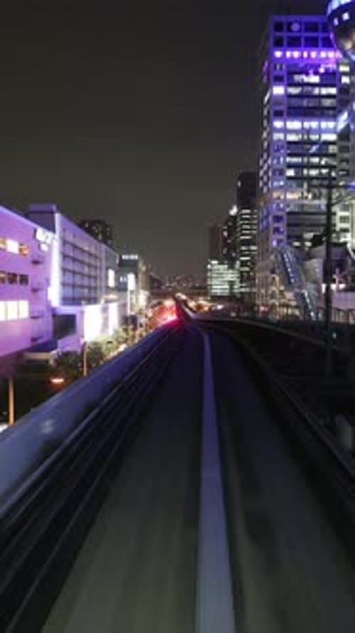 Tokyo Monorail Passing Through the City's Skyscapers in Vertical