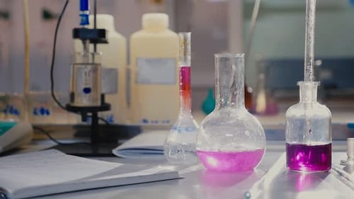 Beakers Filled with Colored Liquids in Science Lab
