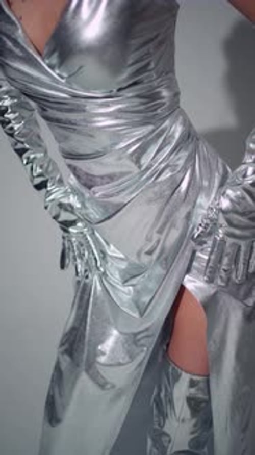 Woman in Silver Metallic Gown and Gloves Posing
