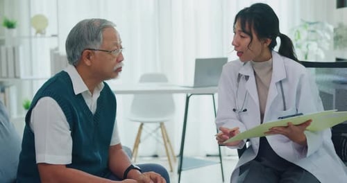 Doctor with old man patient use clipboard for consulting, advice and medical expert in clinic.