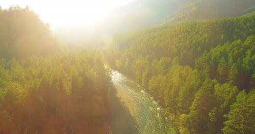 Low Altitude Flight Over Fresh Fast Mountain River with Rocks at Sunny Summer Morning