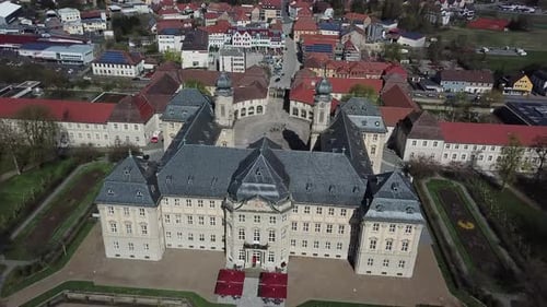 Historic palace in the middle of a german city, aerial view, 4k
