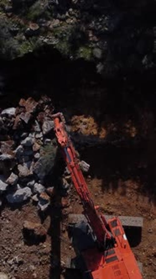 The Image of the Excavator Moving Upwards