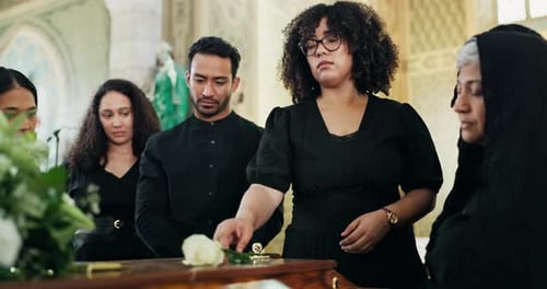 Death, church or family by coffin with flowers at memorial service for respect, support and comfort
