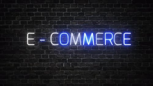 E-Commerce Neon Sign Flickering on Dark Brick Wall
