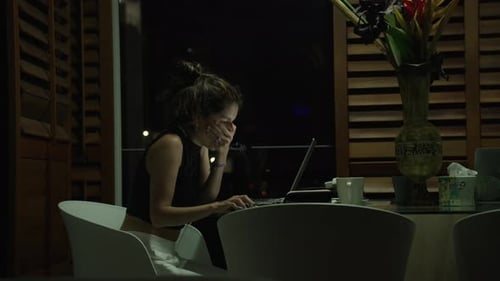 Young Woman Working Late at Night on Laptop