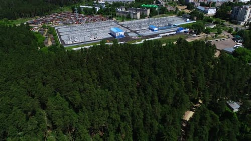 Electrical Distribution Substation Near Forest on Summer Day