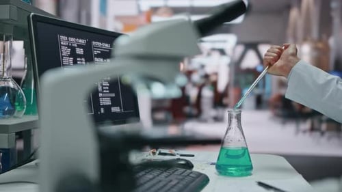 Scientist Hand Filling Pipette From Flask Making Experiment Laboratory Close Up