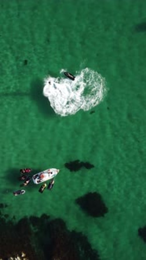 A Man Flies on a FlyBoard Aerial Top Down View Water Extreme Sport Azure Summer Sea with Outdoors