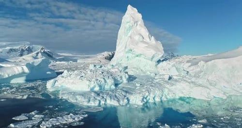 Melting Iceberg Reflecting in Crystal Ocean Water