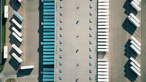 Aerial view of goods warehouse. Logistics center in industrial city zone from above. Aerial view of
