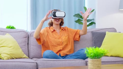Woman Enjoys Virtual Reality Experience at Home