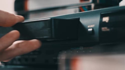 Insert VHS Cassette Into VCR Video Player