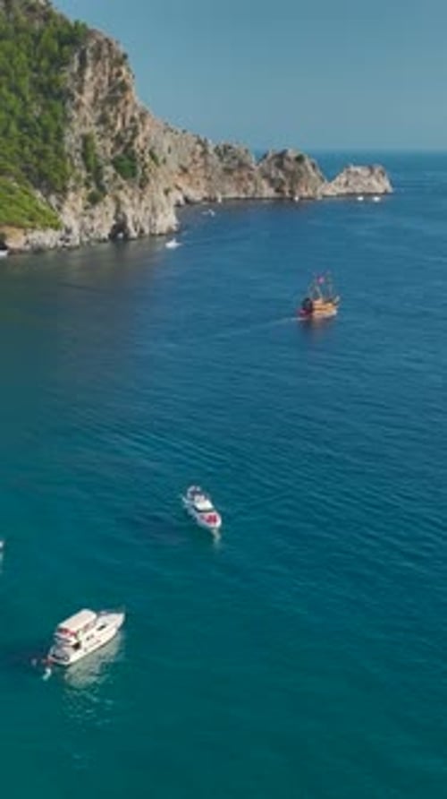 Vertical Video Mediterranean Majesty Yachts on the Azure Coastline