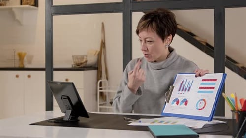 Business Woman Presents Charts During Video Conference