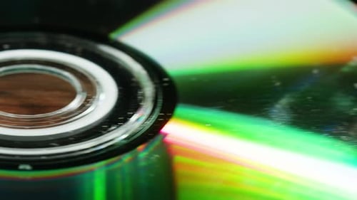 CD Disks on Black Background Closeup Old Vintage Disks for DVD Player or Computer Music Recorder